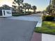 Community entrance featuring the Arden Preserve sign, attractive landscaping, and secure gate at 20983 Monza Loop, Land O Lakes, FL 34638