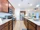 Modern kitchen featuring stainless steel appliances, countertops, and ample cabinet space at 20983 Monza Loop, Land O Lakes, FL 34638