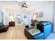 Comfortable living room with stylish seating, hardwood floors, and elegant decor at 20983 Monza Loop, Land O Lakes, FL 34638