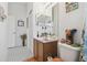 Bathroom with tile flooring, decorative accents, and wood vanity at 21840 Waverly Shores Ln, Land O Lakes, FL 34637