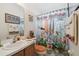 Bathroom with playful decor and surfboard shower curtain at 21840 Waverly Shores Ln, Land O Lakes, FL 34637