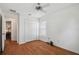 Spare bedroom featuring hardwood floors, ceiling fan, and large closet at 21840 Waverly Shores Ln, Land O Lakes, FL 34637