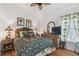 Bedroom with tropical decor including bamboo furniture, palm tree lamps, and matching curtains at 21840 Waverly Shores Ln, Land O Lakes, FL 34637
