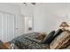 Bedroom with tropical decor and view into hallway at 21840 Waverly Shores Ln, Land O Lakes, FL 34637