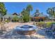 Community fire pit and seating area set amidst well-maintained landscaping at 21840 Waverly Shores Ln, Land O Lakes, FL 34637