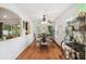 Dining area with hardwood floors, arched doorway, and unique decor, creating an inviting space at 21840 Waverly Shores Ln, Land O Lakes, FL 34637