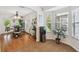 Cozy dining area with a view of the bay window, complemented by a bar area and stylish decor at 21840 Waverly Shores Ln, Land O Lakes, FL 34637