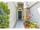 Inviting front entryway featuring decorative stone and attractive landscaping at 21840 Waverly Shores Ln, Land O Lakes, FL 34637