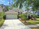 Charming single Gathering home featuring a 2 car garage and beautiful landscaping at 21840 Waverly Shores Ln, Land O Lakes, FL 34637