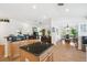 Bright kitchen with a center island, granite countertops, and open floor plan to the dining and living areas at 21840 Waverly Shores Ln, Land O Lakes, FL 34637