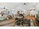 Living area featuring an open layout, comfortable seating, and seamless flow into the dining and kitchen spaces at 21840 Waverly Shores Ln, Land O Lakes, FL 34637