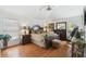 Well-lit main bedroom featuring wood floors, a coordinated furniture set, and a peaceful ambiance at 21840 Waverly Shores Ln, Land O Lakes, FL 34637