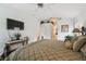 Comfortable main bedroom with plush bedding, a television, and serene decor for a restful retreat at 21840 Waverly Shores Ln, Land O Lakes, FL 34637