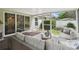 This screened patio offers a comfortable seating area and serene views of the private backyard at 21840 Waverly Shores Ln, Land O Lakes, FL 34637
