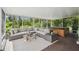 Relaxing screened-in porch including comfortable seating and a hot tub at 21840 Waverly Shores Ln, Land O Lakes, FL 34637