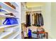 Well-organized closet with shelving and racks for ample storage of clothes, shoes, and personal items at 22338 Bartholdi Cir, Land O Lakes, FL 34639