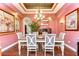 Elegant dining room featuring a tray ceiling, chandelier, and seating for six at 22338 Bartholdi Cir, Land O Lakes, FL 34639