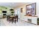 Dining room features a wooden table, seating for six, and a sideboard with a wine rack at 22338 Bartholdi Cir, Land O Lakes, FL 34639