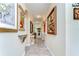 Hallway with tile floors, art niches, recessed lights, and framed art at 22338 Bartholdi Cir, Land O Lakes, FL 34639