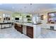 Open kitchen featuring a large island, stainless steel appliances, and an eat-in bar area at 22338 Bartholdi Cir, Land O Lakes, FL 34639