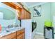 Laundry room with front load washer and dryer, granite counters, and sink at 22338 Bartholdi Cir, Land O Lakes, FL 34639