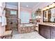 Beautiful main bathroom with a soaking tub, walk-in shower, dual vanities and granite countertops at 22338 Bartholdi Cir, Land O Lakes, FL 34639