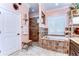 Beautiful bathroom featuring walk-in shower, soaking tub with tile surround, and granite countertops at 22338 Bartholdi Cir, Land O Lakes, FL 34639