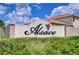 Community sign for Alsace is surrounded by decorative walls and landscaping at 22338 Bartholdi Cir, Land O Lakes, FL 34639