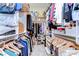 Organized walk-in closet with shelving, hanging rods, and storage for clothing, shoes and accessories at 22338 Bartholdi Cir, Land O Lakes, FL 34639