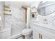 Modern bathroom with a luxurious shower system, marble tile, and elegant fixtures at 2363 Newburg Ln # B, Safety Harbor, FL 34695