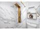 Modern bathroom featuring stylish marble tile and gold shower fixtures at 2363 Newburg Ln # B, Safety Harbor, FL 34695