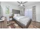 Well-lit bedroom with a modern aesthetic, neutral tones, and plush decor at 2363 Newburg Ln # B, Safety Harbor, FL 34695