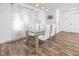 Bright dining area with modern glass table and seating, enhanced by sheer curtains at 2363 Newburg Ln # B, Safety Harbor, FL 34695