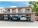 Exterior view of condos with covered parking featuring multiple cars on a sunny day at 2363 Newburg Ln # B, Safety Harbor, FL 34695