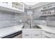 Modern kitchen features a stainless sink, faucet, and backsplash at 2363 Newburg Ln # B, Safety Harbor, FL 34695