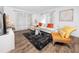 Sunlit living room with stylish furniture and hardwood floors at 2363 Newburg Ln # B, Safety Harbor, FL 34695