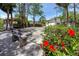 Recreation area with red flowers, bench, bocce court, and gazebo at 2363 Newburg Ln # B, Safety Harbor, FL 34695