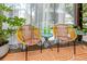 Inviting sunroom featuring comfortable seating and lush greenery for relaxation at 2363 Newburg Ln # B, Safety Harbor, FL 34695
