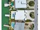 A pristine waterfront residence featuring a private pool, dock, and luxurious landscaping, offering serene waterfront living at 25 Dolphin Dr, Treasure Island, FL 33706