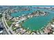 Beautiful aerial view of waterfront homes, canals, and docks in a coastal community with boats at 25 Dolphin Dr, Treasure Island, FL 33706