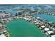 Stunning aerial view featuring waterfront homes, boat docks, and a tranquil waterway at 25 Dolphin Dr, Treasure Island, FL 33706