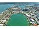 Scenic aerial view highlighting waterfront properties, docks, and a waterway in a coastal neighborhood at 25 Dolphin Dr, Treasure Island, FL 33706