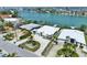 Captivating waterfront property with lush landscaping, circular driveway, and convenient access to the bay at 25 Dolphin Dr, Treasure Island, FL 33706