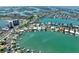 Picturesque aerial view showcasing waterfront homes with private docks and a serene canal setting at 25 Dolphin Dr, Treasure Island, FL 33706