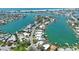 A breathtaking aerial capturing an array of waterfront homes, private docks, and canals leading to the open ocean at 25 Dolphin Dr, Treasure Island, FL 33706
