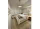 Well-lit bedroom with a cozy bed, unique wallpaper, and modern furnishings at 25 Dolphin Dr, Treasure Island, FL 33706