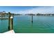 Water view from the dock with clear water and glimpses of the surrounding neighborhood at 25 Dolphin Dr, Treasure Island, FL 33706