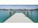 Long dock overlooking the water and nearby houses, offering a serene waterfront experience at 25 Dolphin Dr, Treasure Island, FL 33706