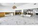 Spacious interior undergoing renovation, featuring marble floors and open layout at 25 Dolphin Dr, Treasure Island, FL 33706