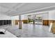 Bright living room with marble floors, a view of the pool, and access to the patio at 25 Dolphin Dr, Treasure Island, FL 33706